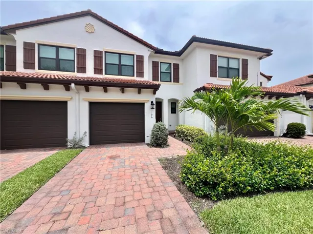 Mediterranean / spanish house featuring a garage