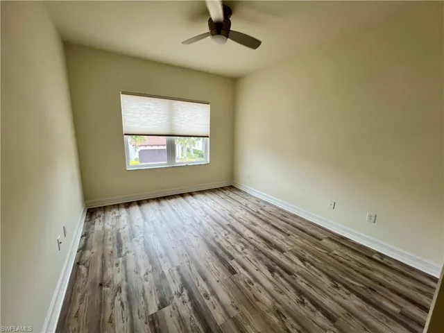 Unfurnished room featuring luxury vinyl plank / wood-style floors and ceiling fan