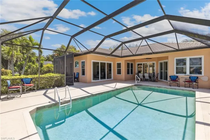 Pool with a patio, a lanai, and a ceiling fan