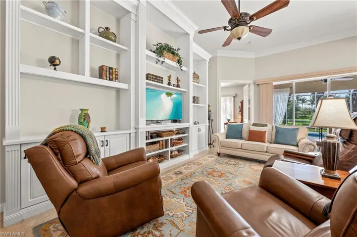 15437 Puffin Drive Bonita Springs FL 34135 - Custom wall unit and crown moulding in living room
