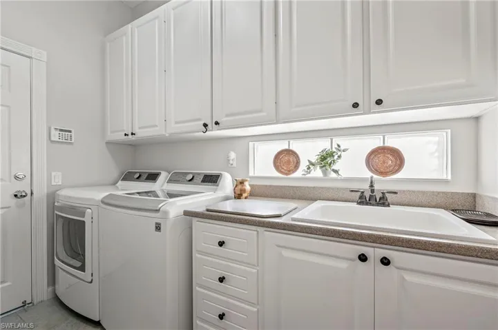 15437 Puffin Drive Bonita Springs FL 34135 - Laundry room with glass block for natural light