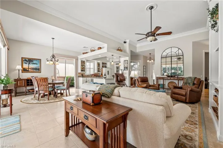 15437 Puffin Drive Bonita Springs FL 34135- Living area connects to kitchen and dining spaces.
