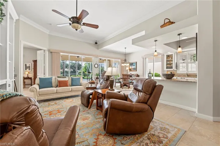 15437 Puffin Drive Bonita Springs FL 34135 - Tiled living area with custom wall unit