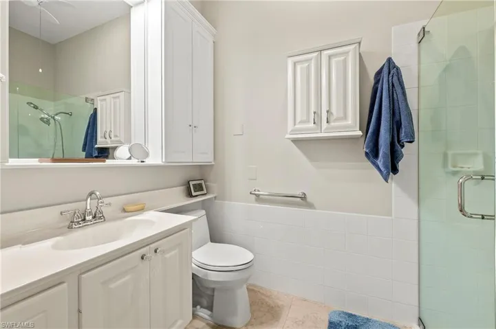 15437 Puffin Drive Bonita Springs FL 34135 - Owner's bath with seamless glass shower doors