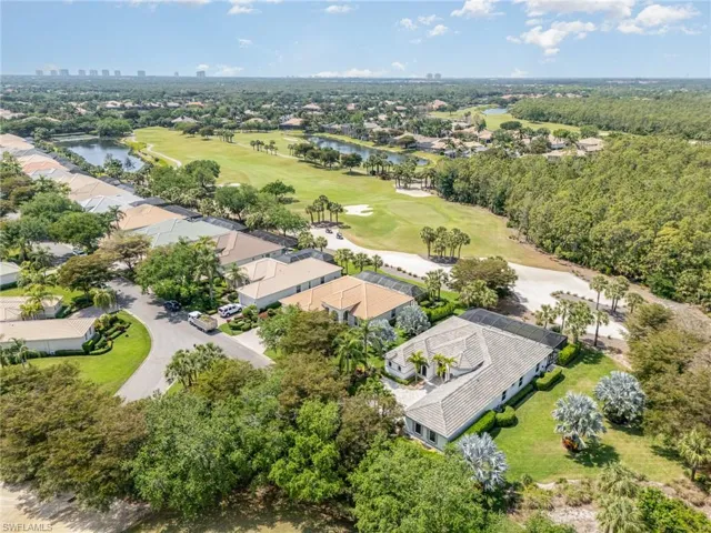 Bird's eye view with a water view and golf course view