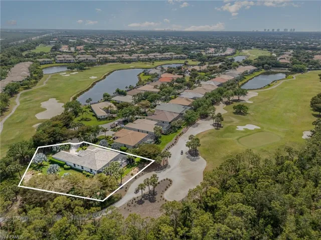 Birds eye view of property featuring a water view, view of golf course, and a residential view