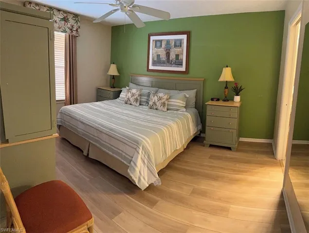 Bedroom with light wood-style floors and ceiling fan