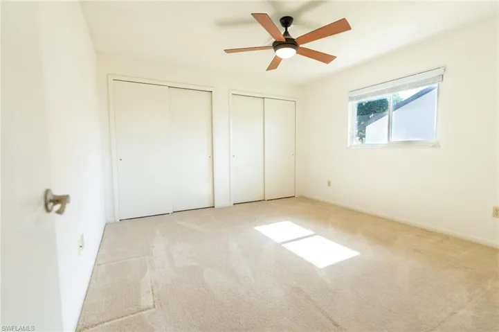 Primary Bathroom with toilet and a shower with shower curtain