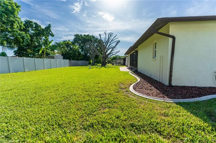 Back of property featuring stucco siding