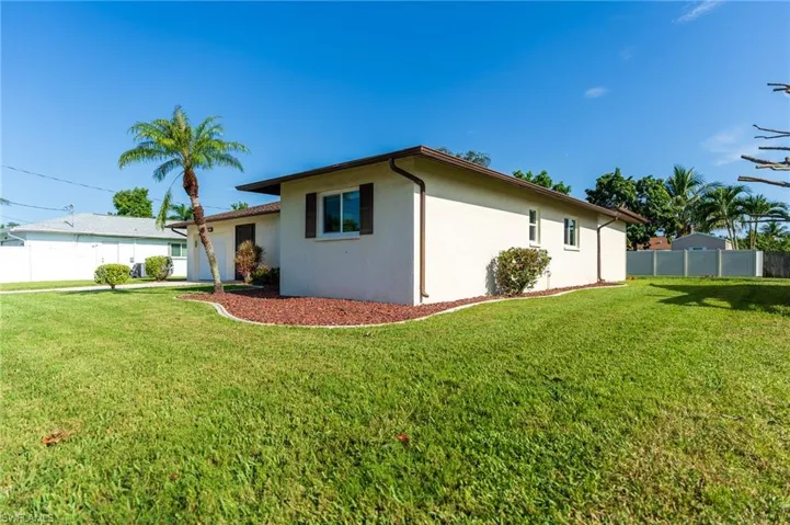 Ranch-style home with a garage, stucco siding, concrete driveway, and roof with shingles