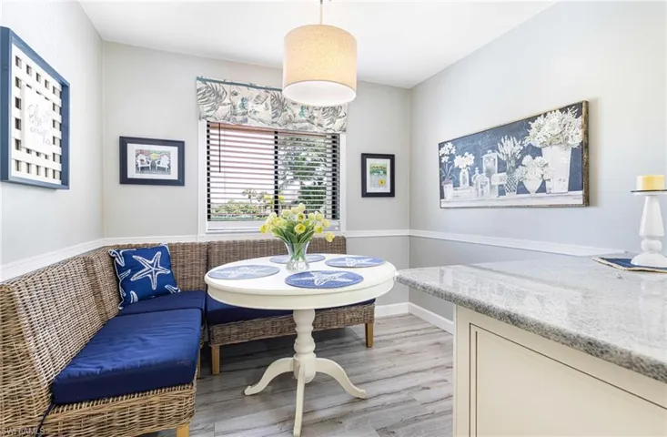 Dining area with light hardwood / wood-style floors