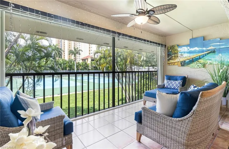 Sunroom featuring ceiling fan and a wealth of natural light
