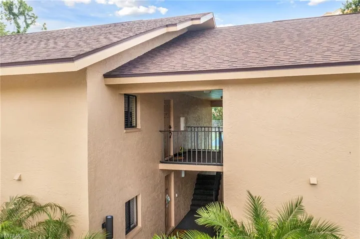 View of home's exterior with a balcony
