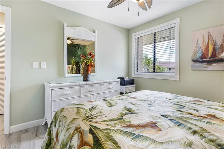 Bedroom featuring light wood-type flooring and ceiling fan