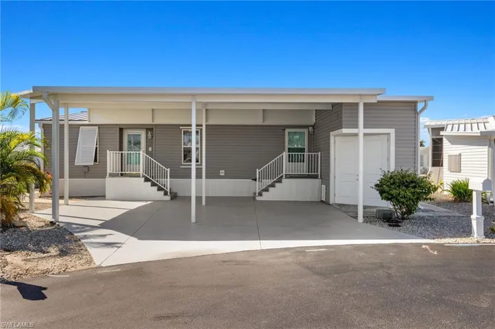 Manufactured / mobile home featuring a carport