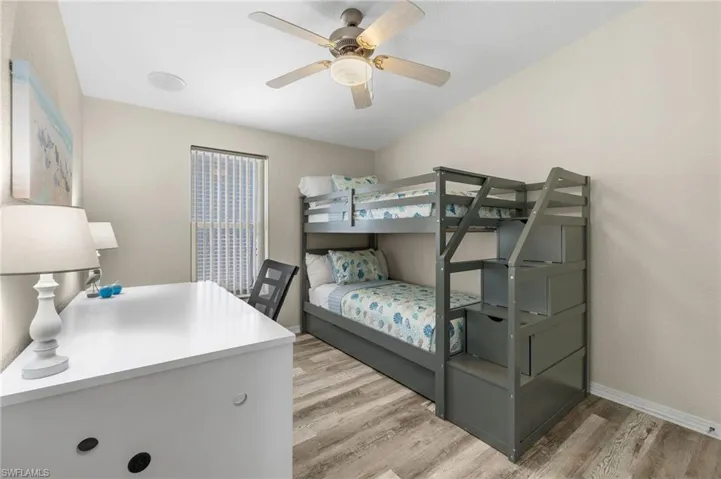 Bedroom featuring light wood-type flooring and ceiling fan