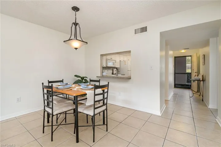 Dining area looking back towards kitchen and entryway.
