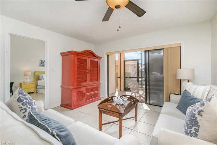 Living room with view of primary bedroom.