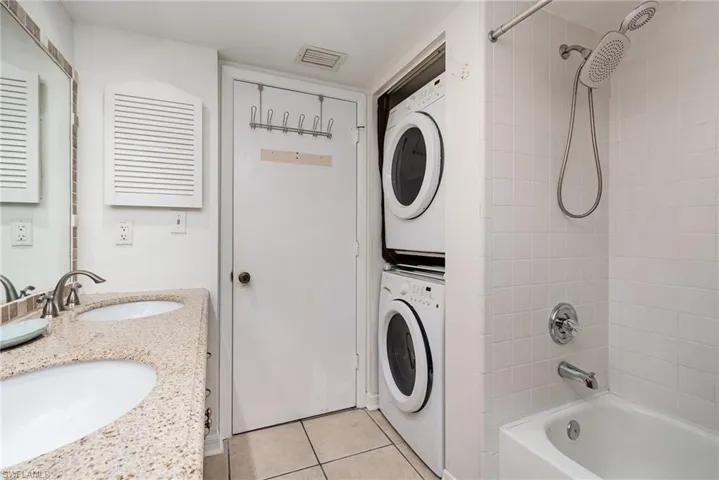 Guest Bathroom also features stacked washer/dryer.
