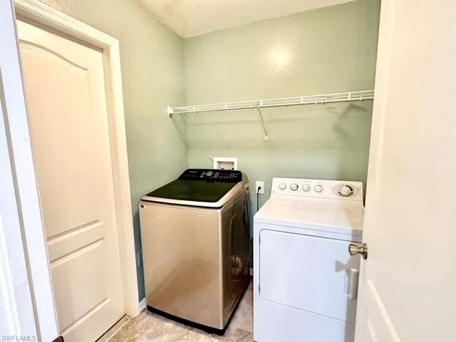 Laundry room featuring separate washer and dryer
