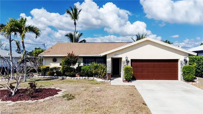 Single story home featuring driveway, a garage, and roof with shingles