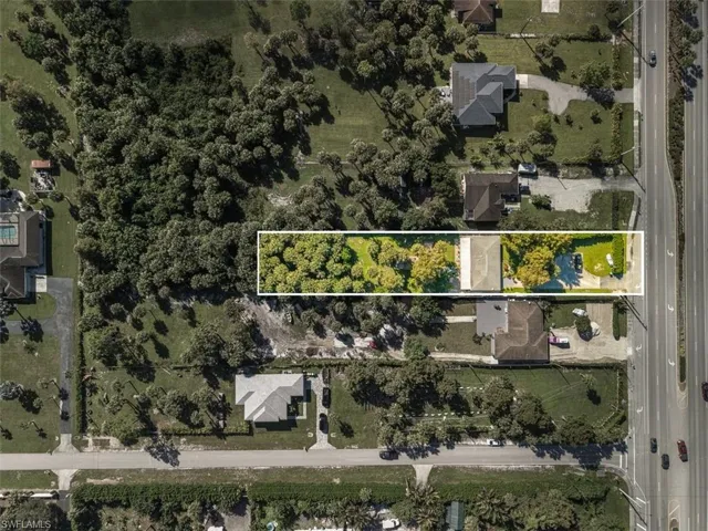 Aerial view of residential area with property parcel outlined
