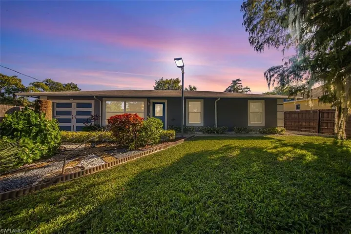 Single story home featuring stucco siding and a garage