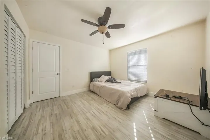 Bedroom featuring light wood-style floors and a ceiling fan