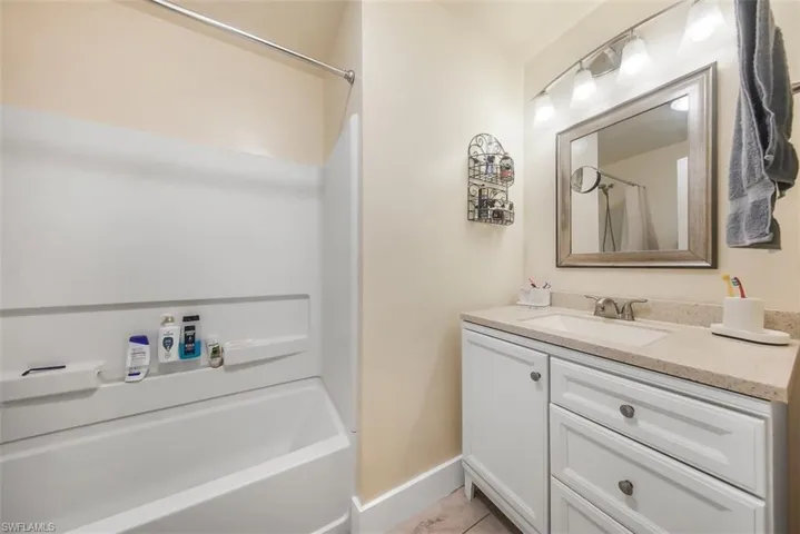 Bathroom featuring vanity and bathing tub / shower combination
