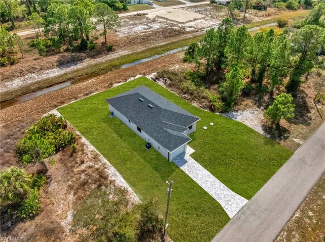 View from above of property with a large body of water