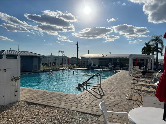 2 of 3 of the community pools featuring a patio