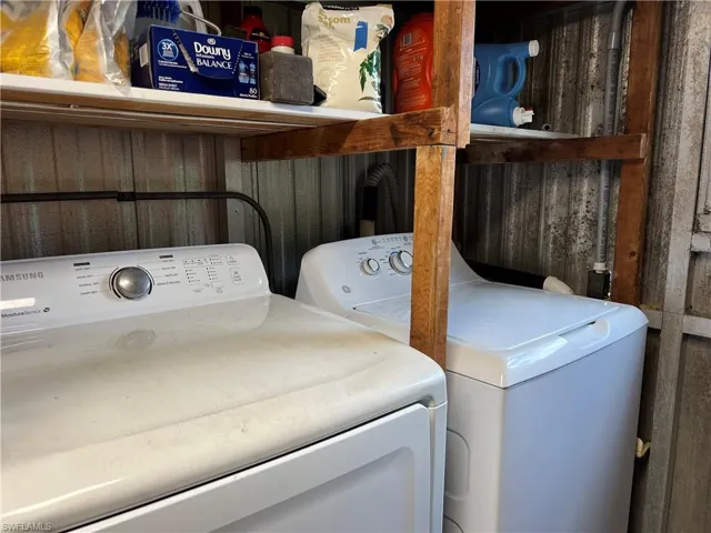 Laundry area featuring washer and dryer and laundry area