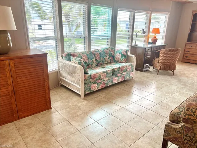 Living area featuring light tile patterned floors
