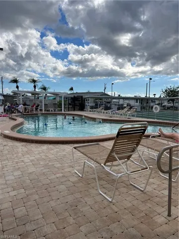 One of the 3 Community pools featuring a patio area