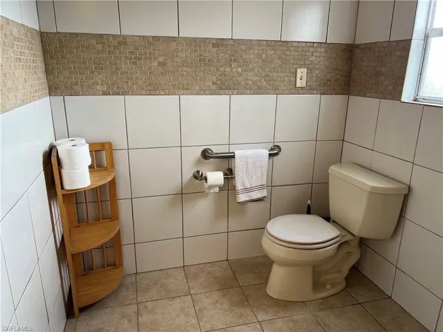 Interior details of large master bathroom, featuring a tile shower floor and ceiling
