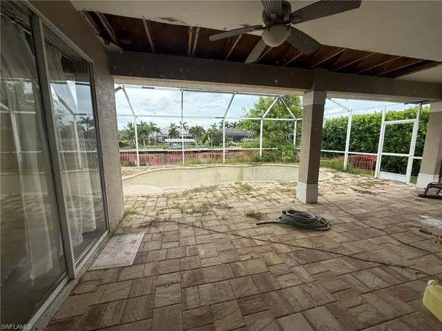 View of patio / terrace featuring a sunroom and glass enclosure