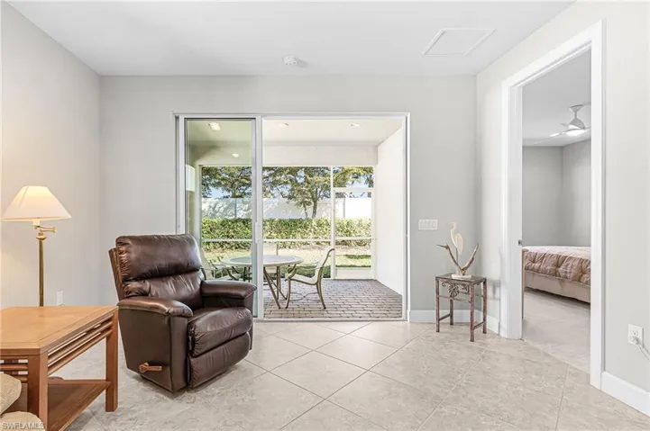 Living area featuring light tile patterned floors