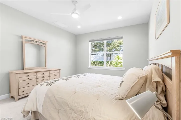 Bedroom featuring ceiling fan, carpet, and recessed lighting