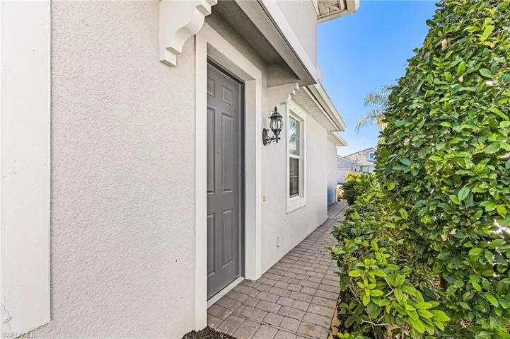 Entrance to property featuring stucco siding