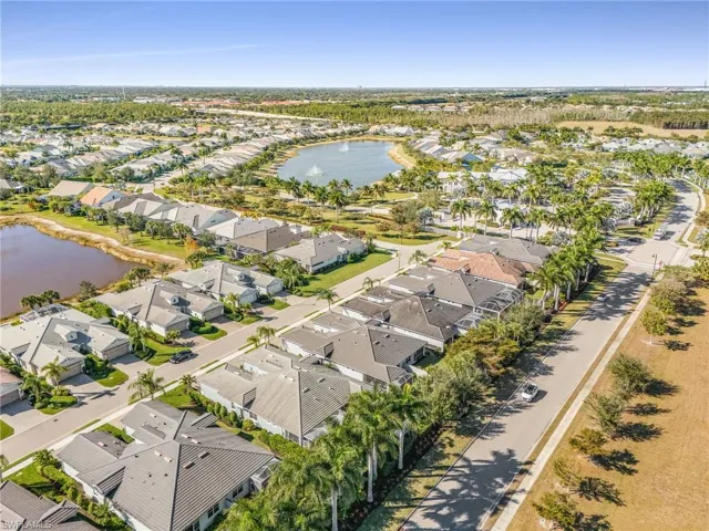 Aerial perspective of suburban area with a nearby body of water