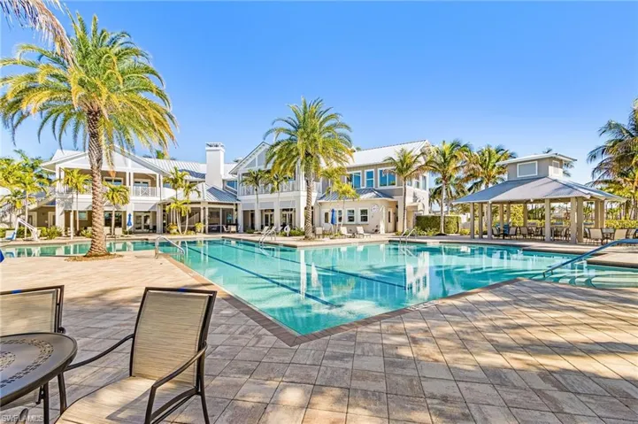Community pool with a patio