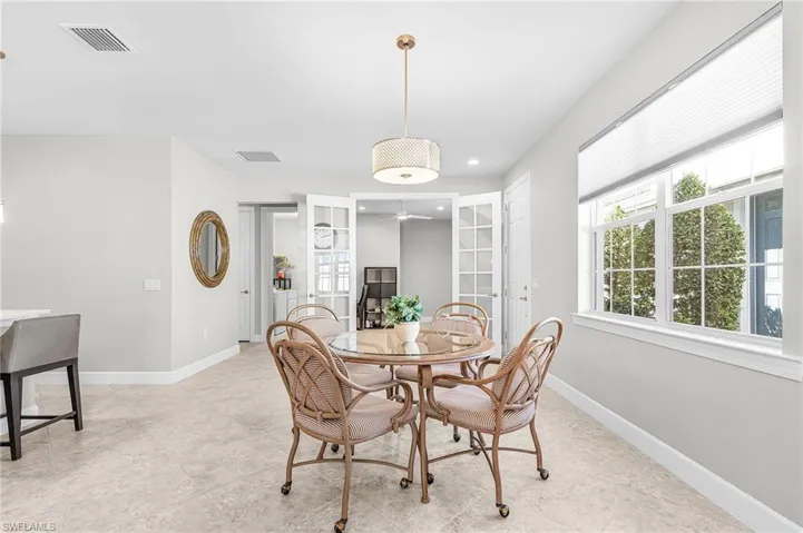Dining room with french doors, recessed lighting, and healthy amount of natural light