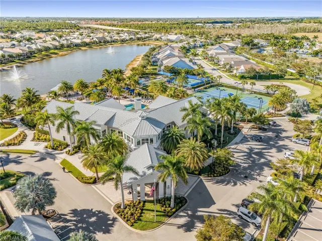 Aerial perspective of suburban area featuring a large body of water
