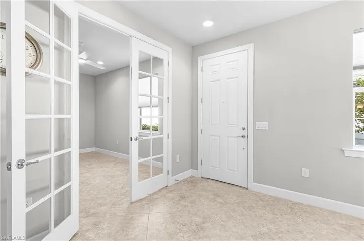 Foyer with recessed lighting and french doors