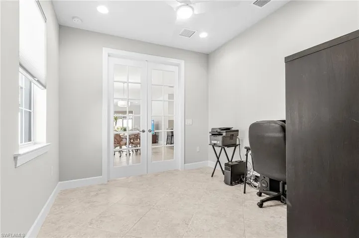 Office with french doors, recessed lighting, and light tile patterned floors