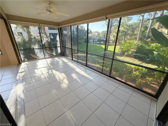 Unfurnished sunroom with tile patterned flooring