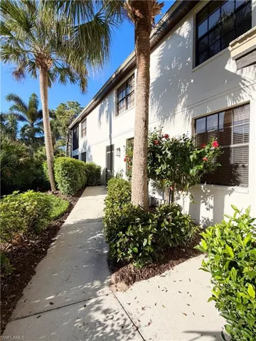 View of side of property featuring stucco siding