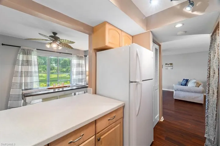 Kitchen open to Dining area with breakfast bar