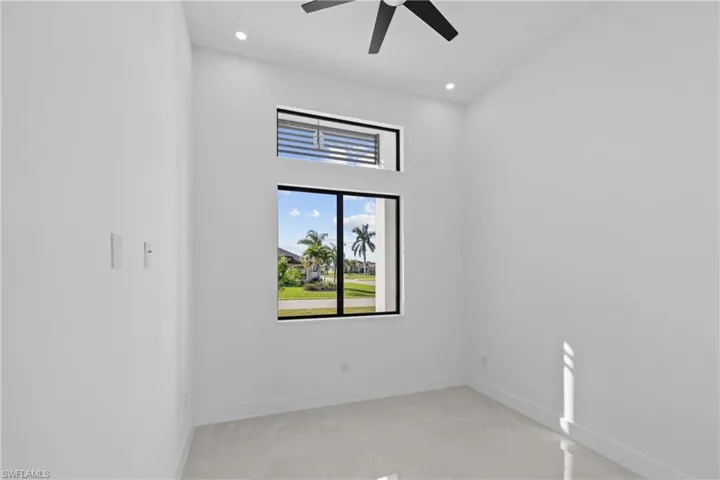 Unfurnished room featuring a ceiling fan, recessed lighting, and baseboards