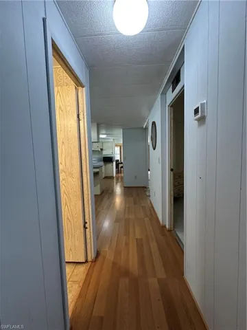 Corridor with light wood finished floors